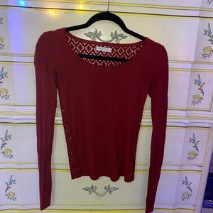 Red long sleeve shirt , lace in the back